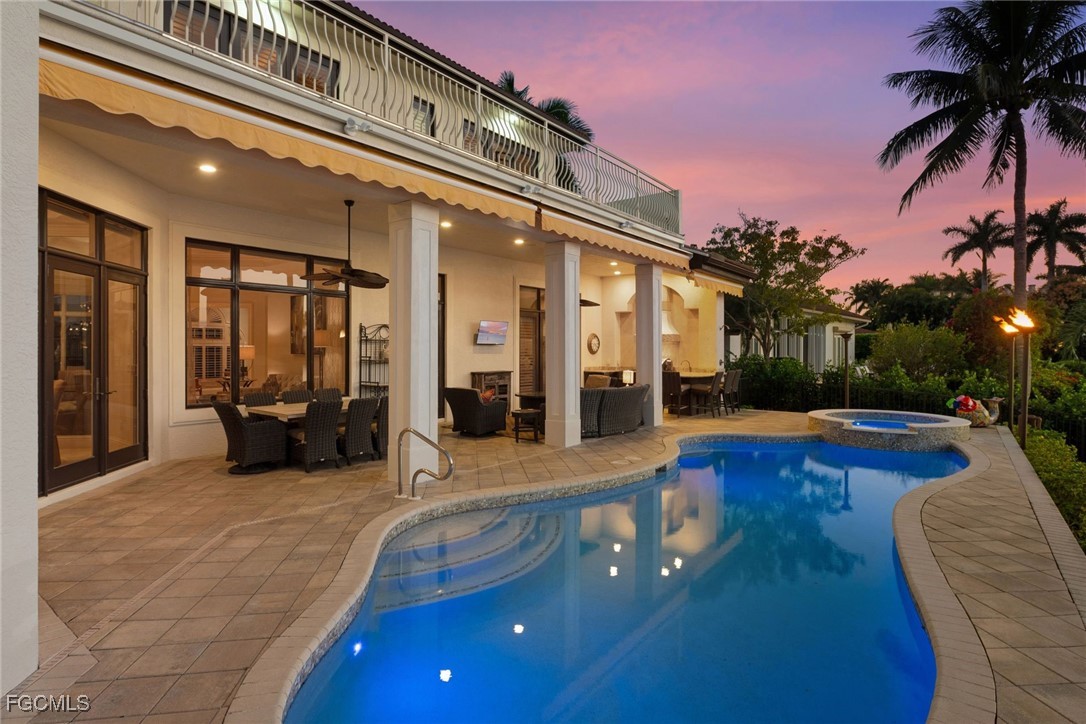 361 Pirates Bight Naples, FL 34103 - Photo 31 of 33 a view of a house with swimming pool and sitting area