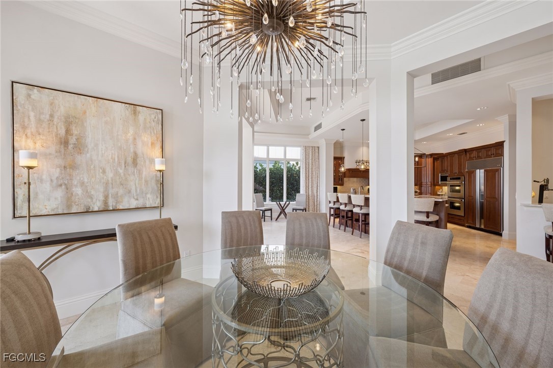 361 Pirates Bight Naples, FL 34103 - Photo 5 of 33 a living room with furniture and a large window