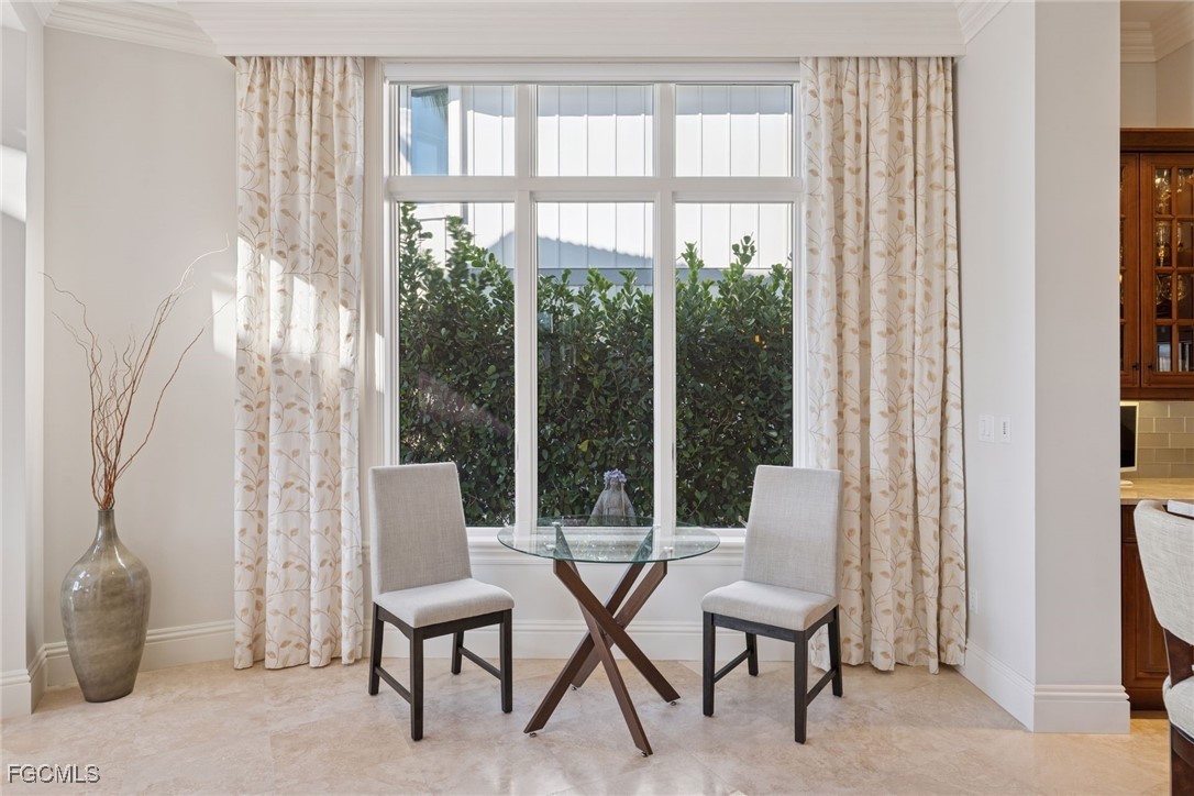 361 Pirates Bight Naples, FL 34103 - Photo 6 of 33 a balcony with chairs and table