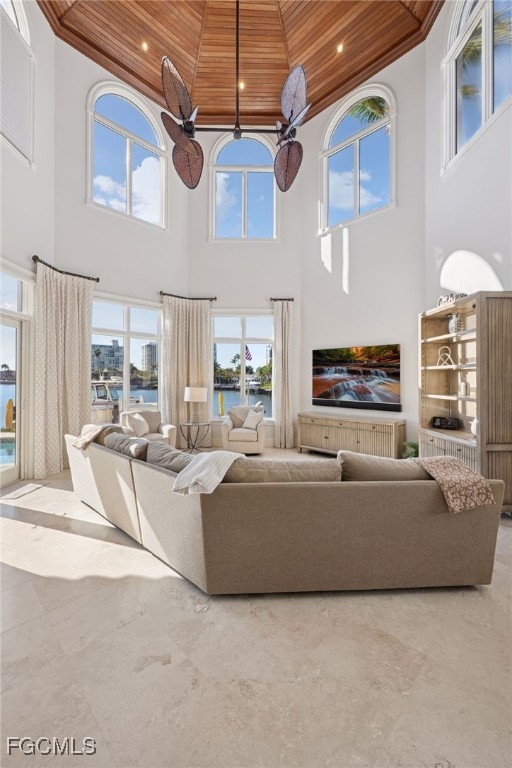 361 Pirates Bight Naples, FL 34103 - Photo 7 of 33 a living room with furniture and a flat screen tv