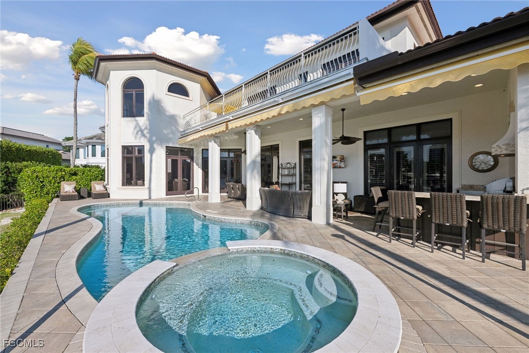 361 Pirates Bight Naples, FL 34103 - Photo 10 of 33 a view of a building with porch