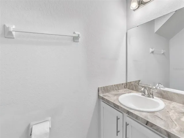 a view of staircase with white walls