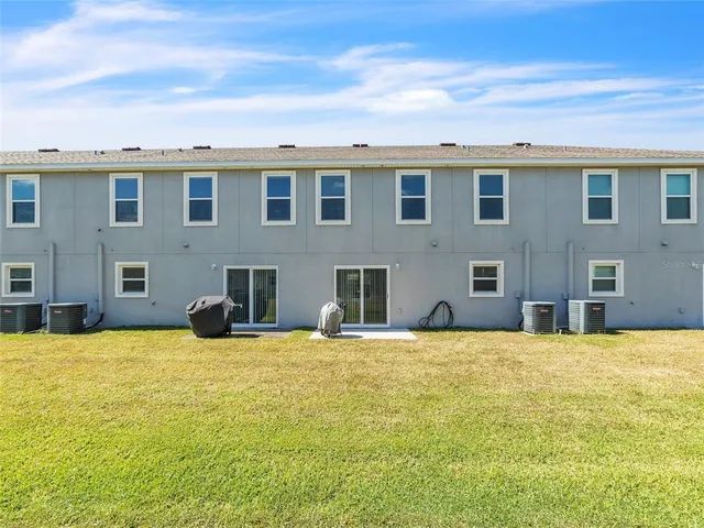 an aerial view of a house with a garden and a bench