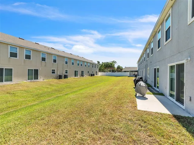 an aerial view of residential house with outdoor space and lake view