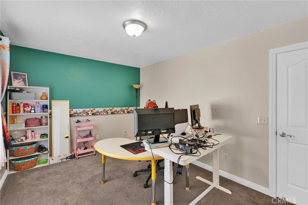 11158 Pinon Avenue Hesperia, CA 92345 - Photo 19 of 39 a table and chairs in a room