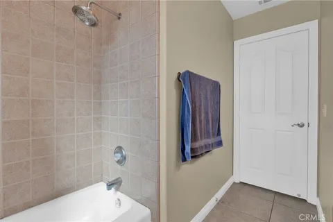 a bathroom with a bathtub and shower