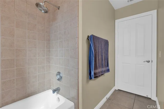 a bathroom with a bathtub and shower