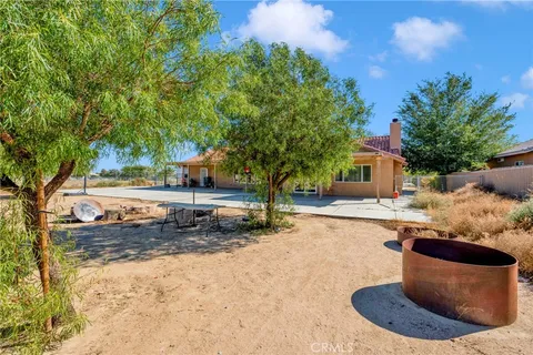 a swimming pool with outdoor seating