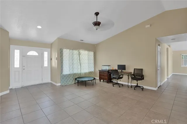 a view of a livingroom with furniture and a window