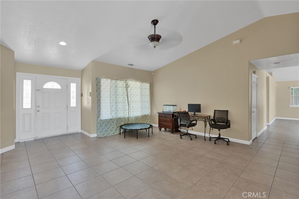 11158 Pinon Avenue Hesperia, CA 92345 - Photo 3 of 39 a view of a livingroom with furniture and a window