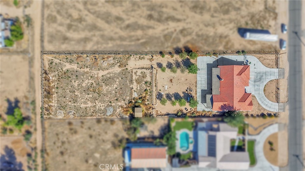 11158 Pinon Avenue Hesperia, CA 92345 - Photo 31 of 39 view of a lake with a building in the background