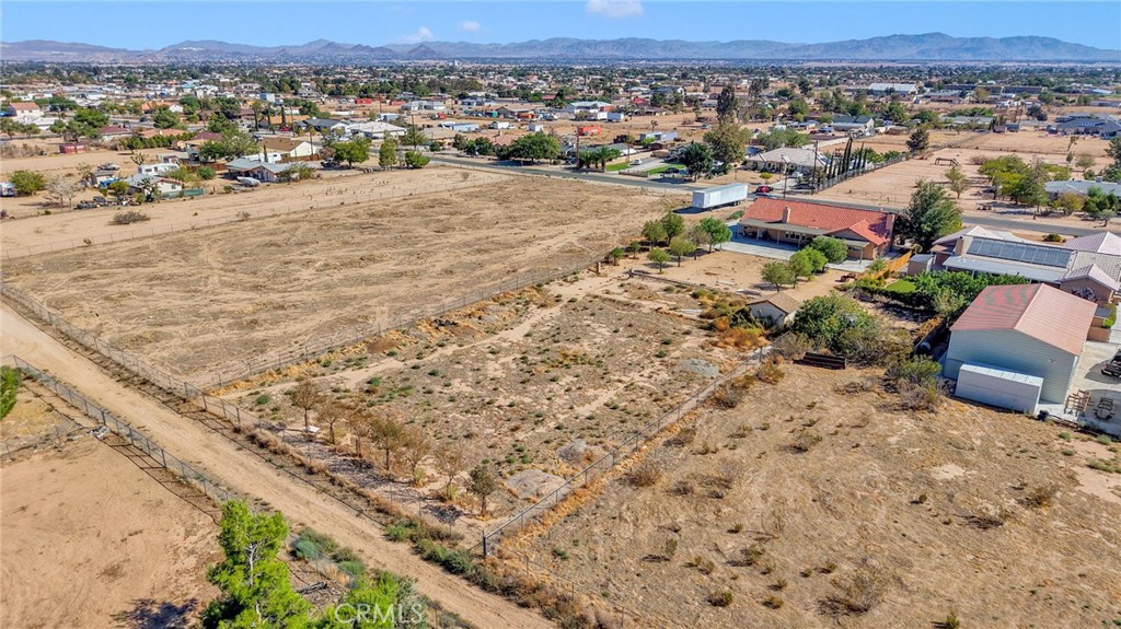 11158 Pinon Avenue Hesperia, CA 92345 - Photo 39 of 39 an aerial view of a house with a yard and lake view