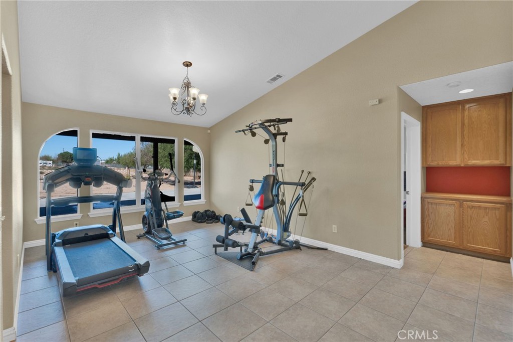 11158 Pinon Avenue Hesperia, CA 92345 - Photo 6 of 39 a view of a room with gym equipment