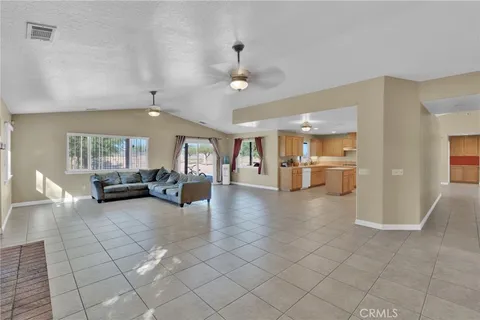 a view of a livingroom with furniture and a window