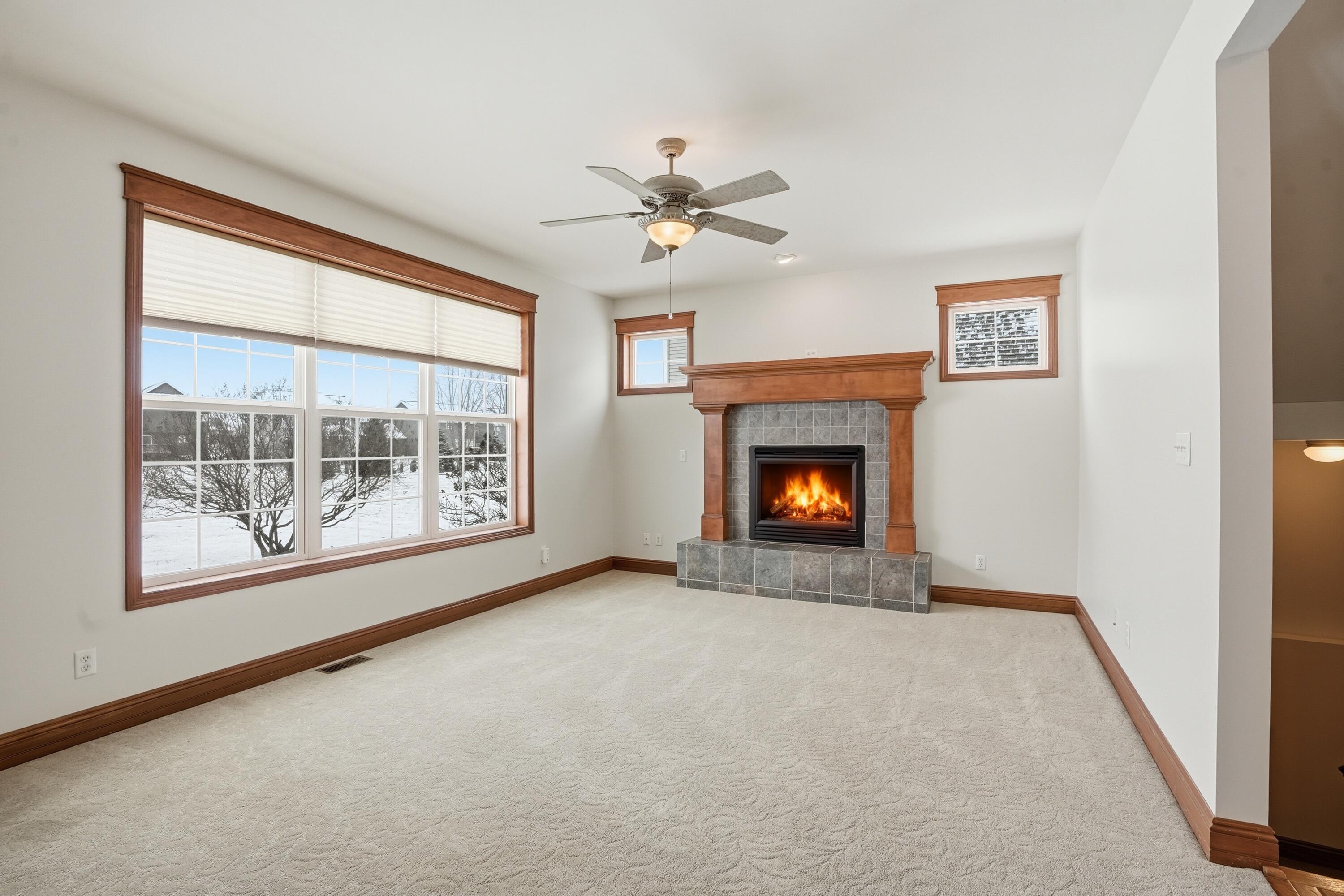 1144 Mary Ellen Drive Crown Point, IN 46307 - Photo 11 of 47 a view of an empty room with a fireplace and a window
