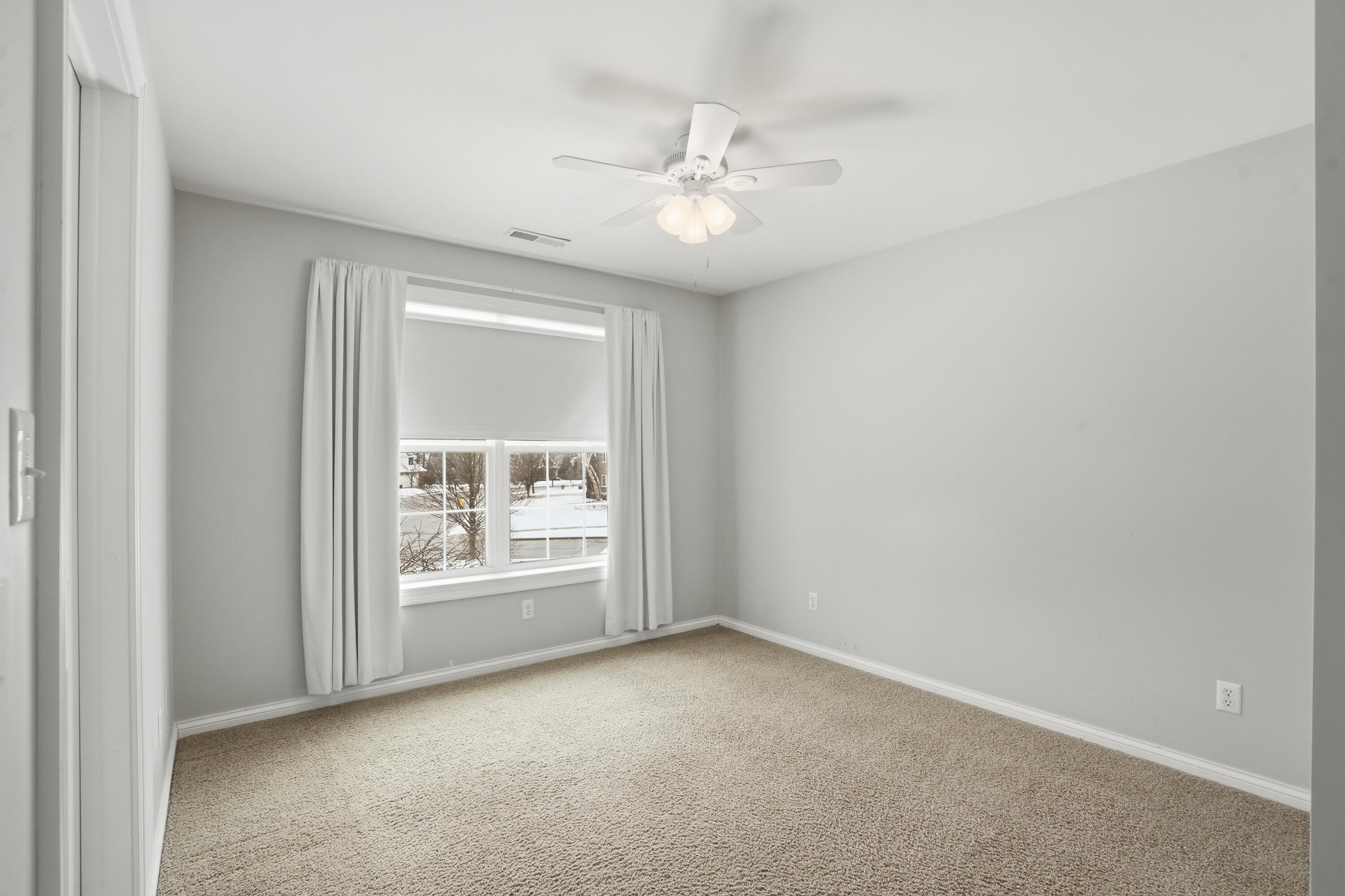 1144 Mary Ellen Drive Crown Point, IN 46307 - Photo 27 of 47 an empty room with windows and fan
