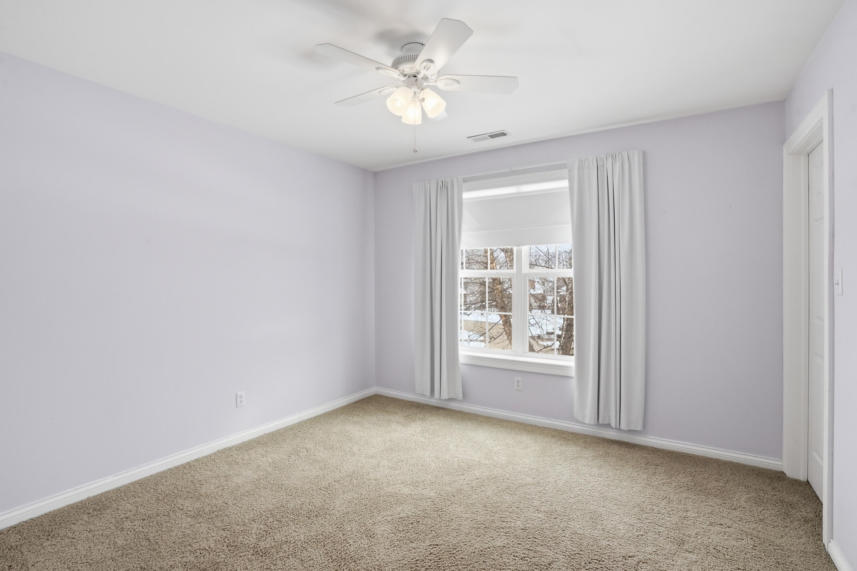1144 Mary Ellen Drive Crown Point, IN 46307 - Photo 28 of 47 an empty room with windows and ceiling fan