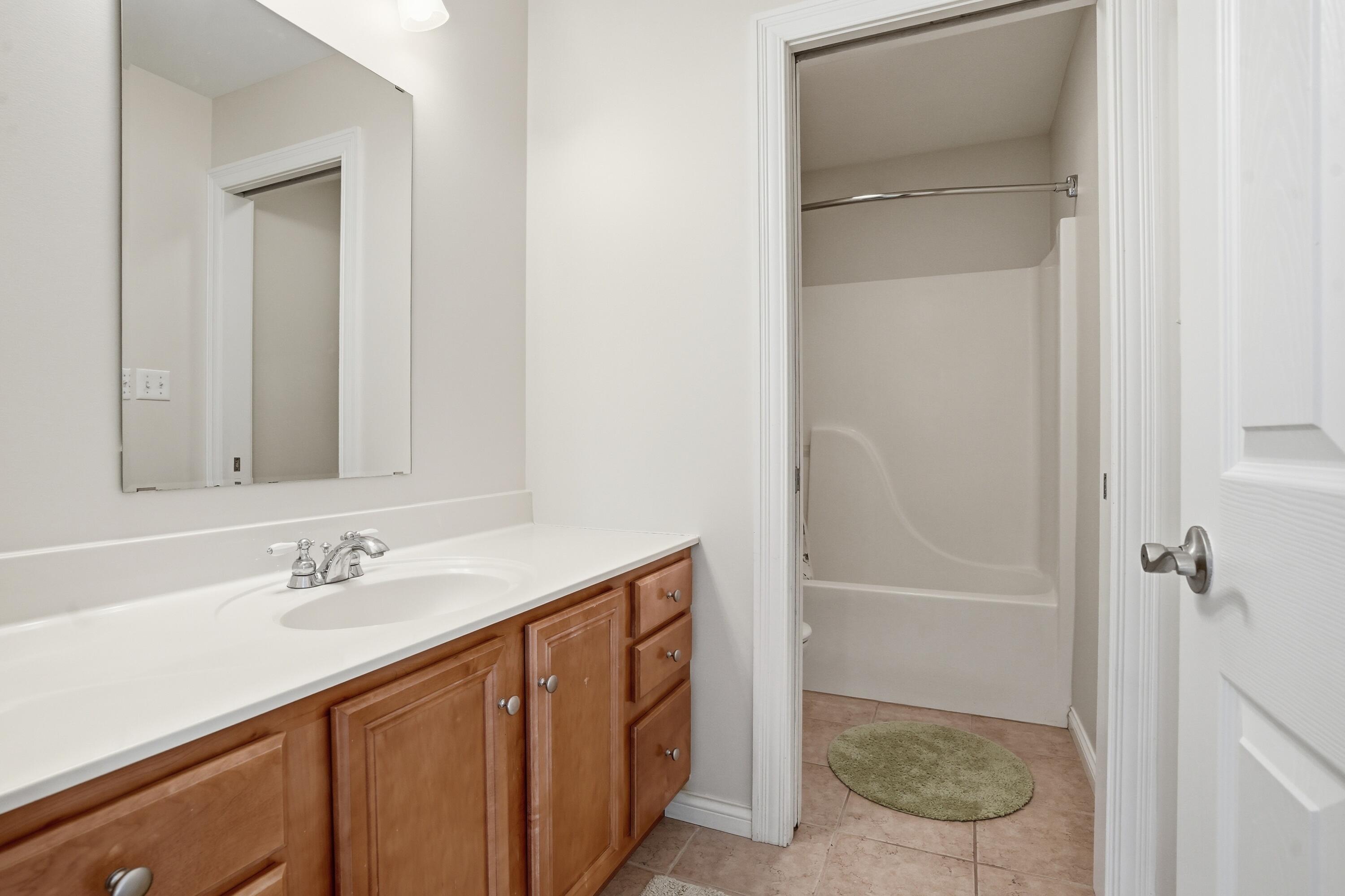 1144 Mary Ellen Drive Crown Point, IN 46307 - Photo 30 of 47 a bathroom with a granite countertop sink and a mirror
