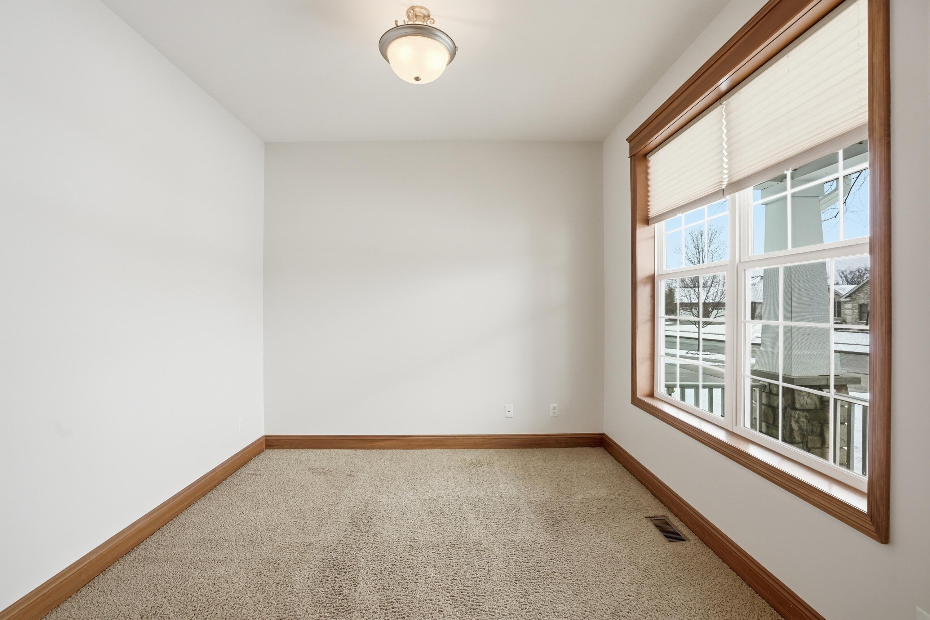 1144 Mary Ellen Drive Crown Point, IN 46307 - Photo 10 of 47 a view of an empty room with a window
