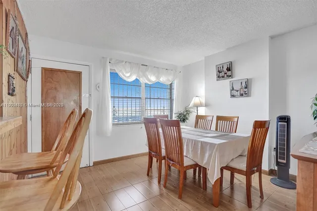 a living room with furniture and a lamp