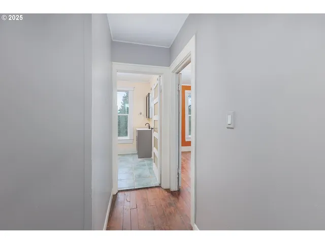 a view interior of a house wooden floor and an entryway