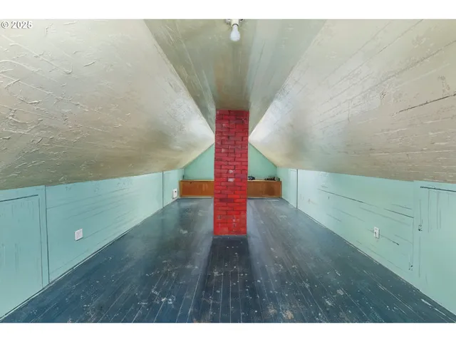 a aerial view of a house with a yard