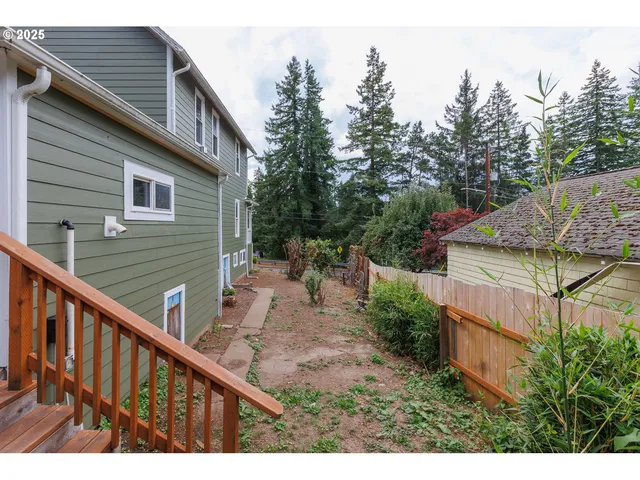 an aerial view of residential house with outdoor space