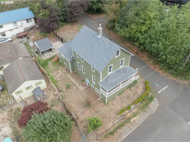 an aerial view of a house with mountain view
