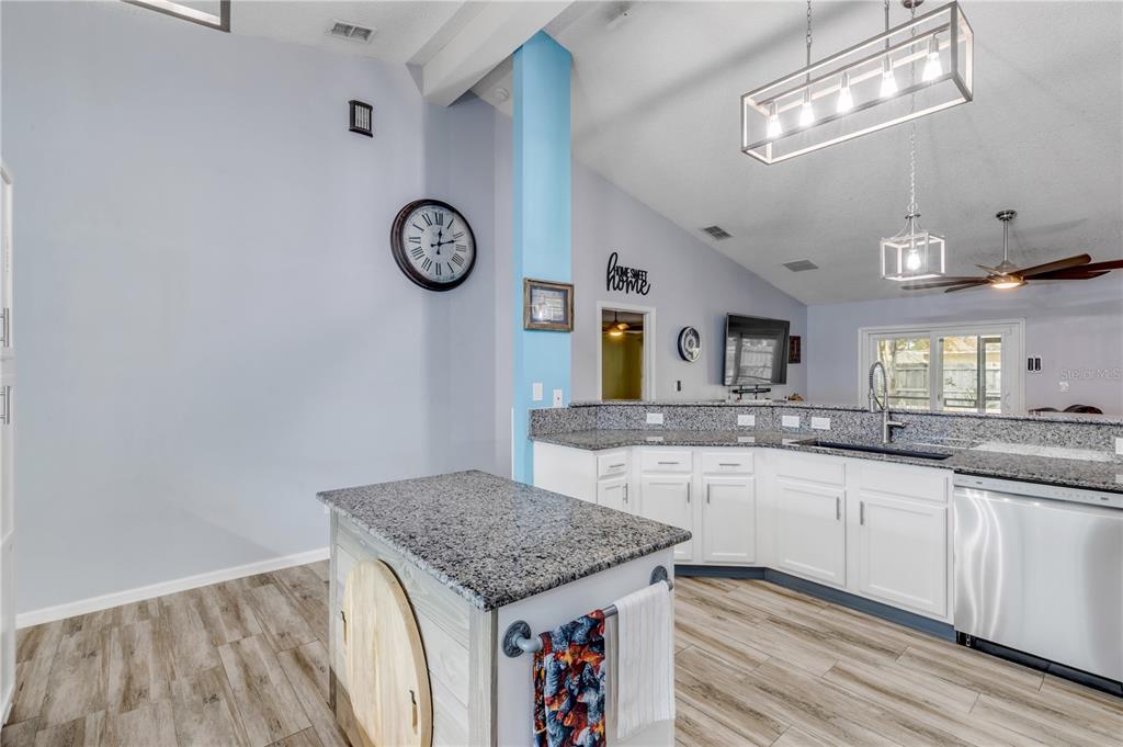 7 Ranbay Place Palm Coast, FL 32164 - Photo 18 of 76 a bathroom with a granite countertop sink and a mirror