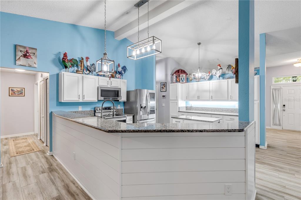 7 Ranbay Place Palm Coast, FL 32164 - Photo 28 of 76 a bathroom with a granite countertop sink and a mirror