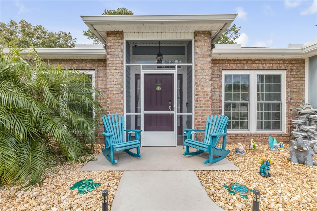 7 Ranbay Place Palm Coast, FL 32164 - Photo 3 of 76 a front view of a house with a garden