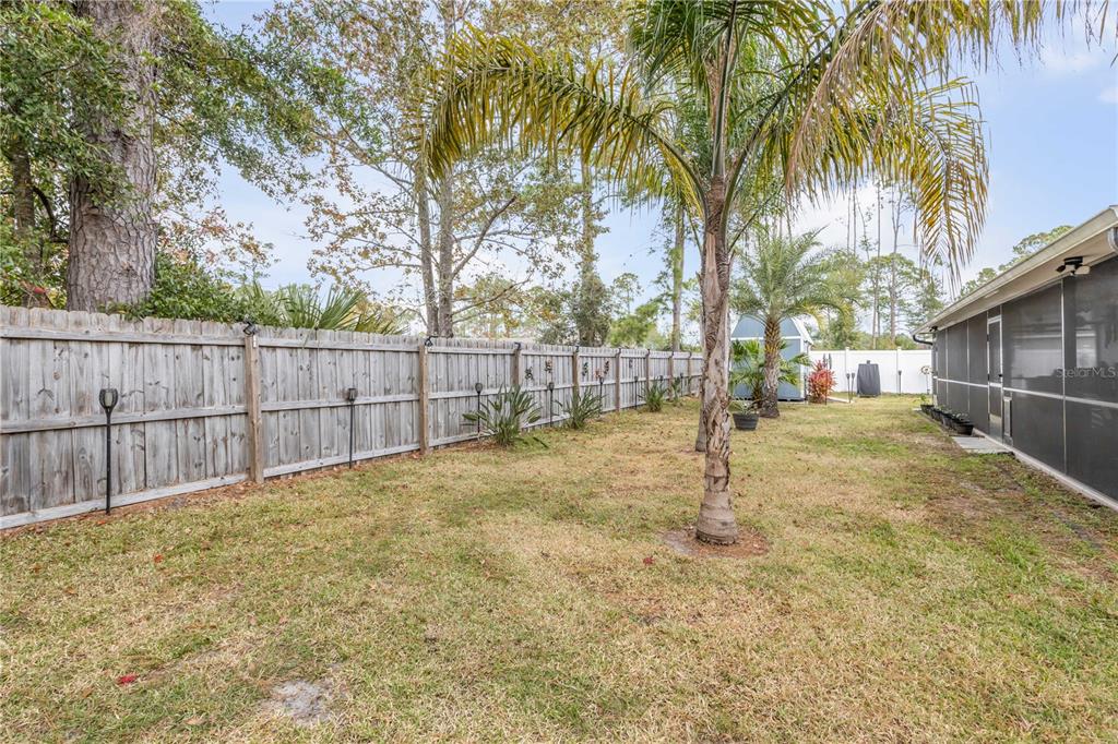 7 Ranbay Place Palm Coast, FL 32164 - Photo 49 of 76 a view of backyard with wooden fence