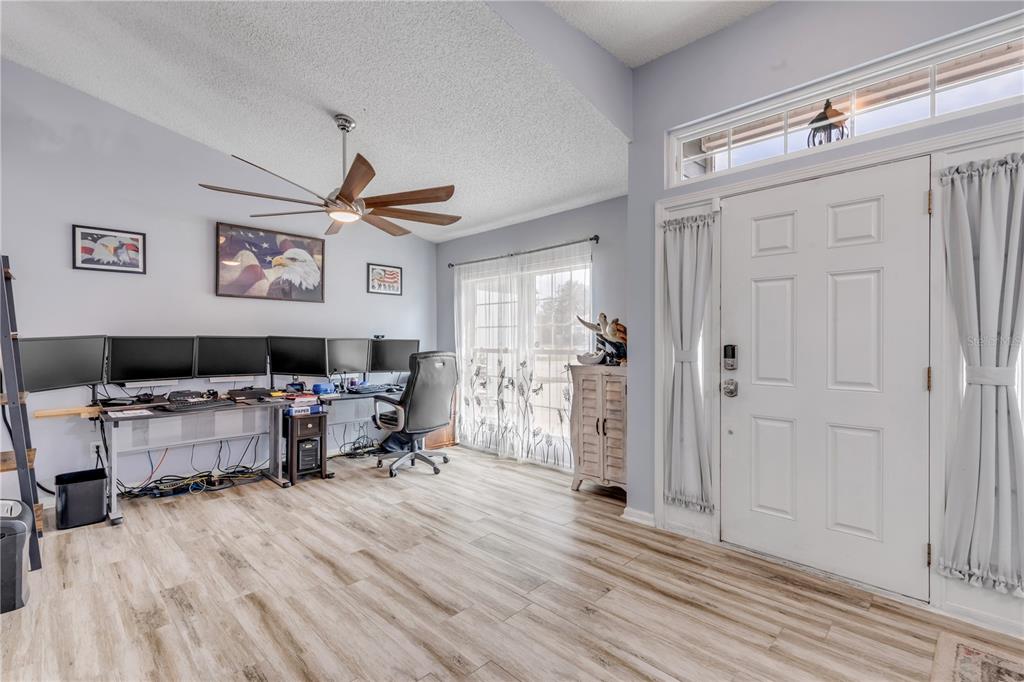 7 Ranbay Place Palm Coast, FL 32164 - Photo 9 of 76 a living room with furniture and a wooden floor