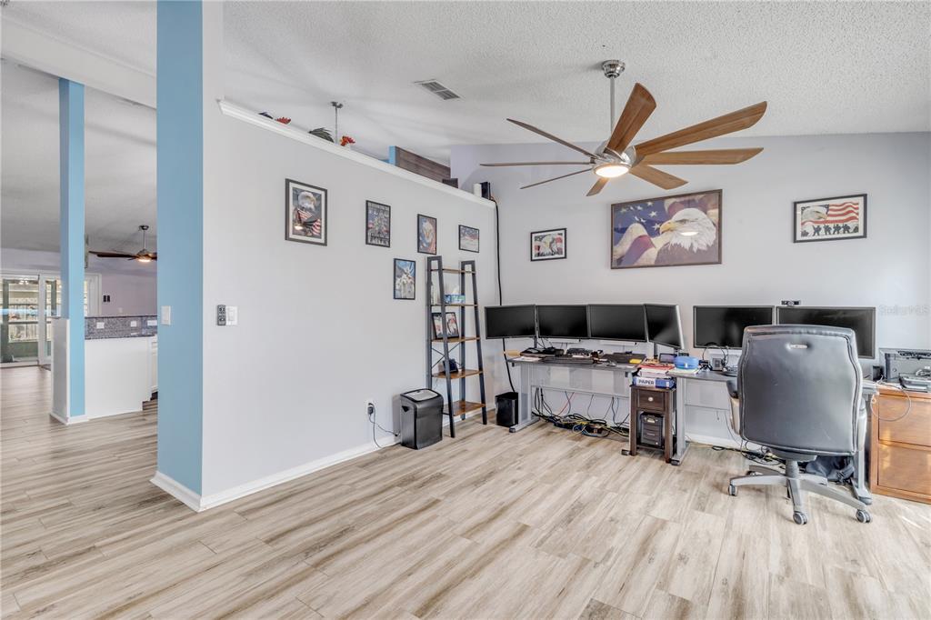 7 Ranbay Place Palm Coast, FL 32164 - Photo 10 of 76 a living room with furniture and a wooden floor