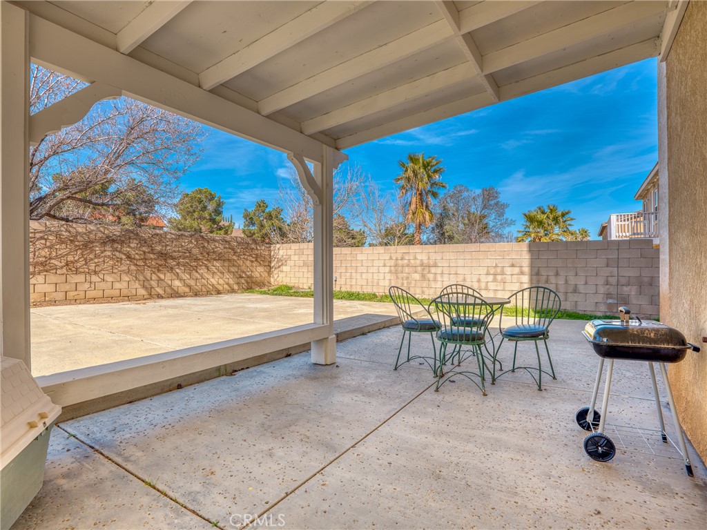 39233 Chantilly Lane Palmdale, CA 93551 - Photo 25 of 31 a view of a tables and chair in the room