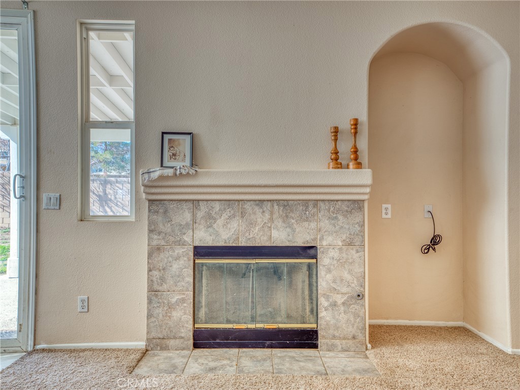39233 Chantilly Lane Palmdale, CA 93551 - Photo 9 of 31 a living room with a fireplace