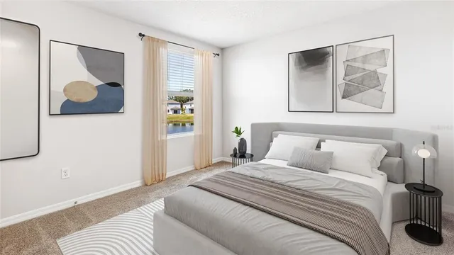 a bedroom with a bed and painting on the wall