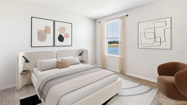 a bedroom with a bed and a couch