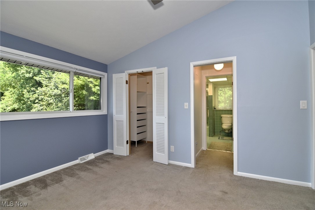 2793 Belgrave Road Cleveland, OH 44124 - Photo 28 of 40 Unfurnished bedroom with vaulted ceiling, carpet floors, a spacious closet, and a closet