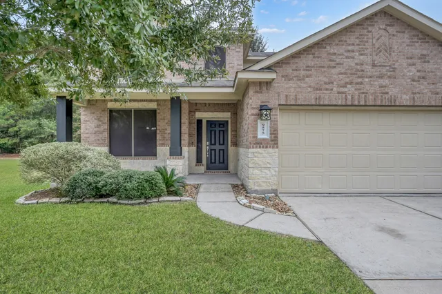 front view of a house with a garden