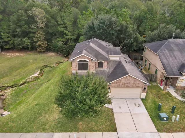 an aerial view of residential house with outdoor space