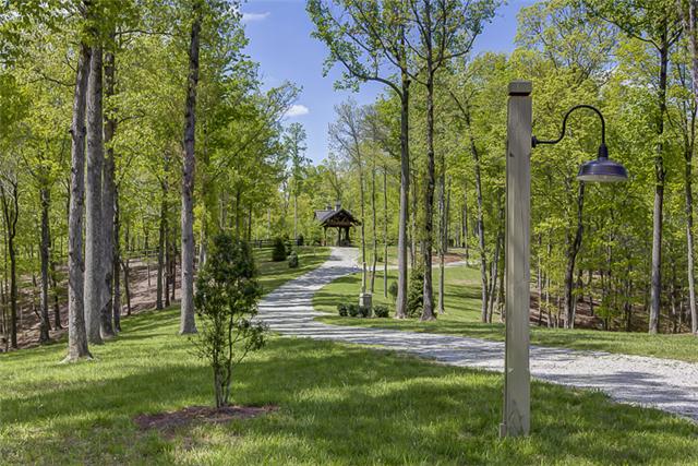 2890 Webb Hollow Road Williamsport, TN 38487 - Photo 3 of 20 Twenty-eight post lights accent the driveways. In addition, 2 miles of trails were developed as well as .5 miles of gravel driveway with grading and proper drainage.