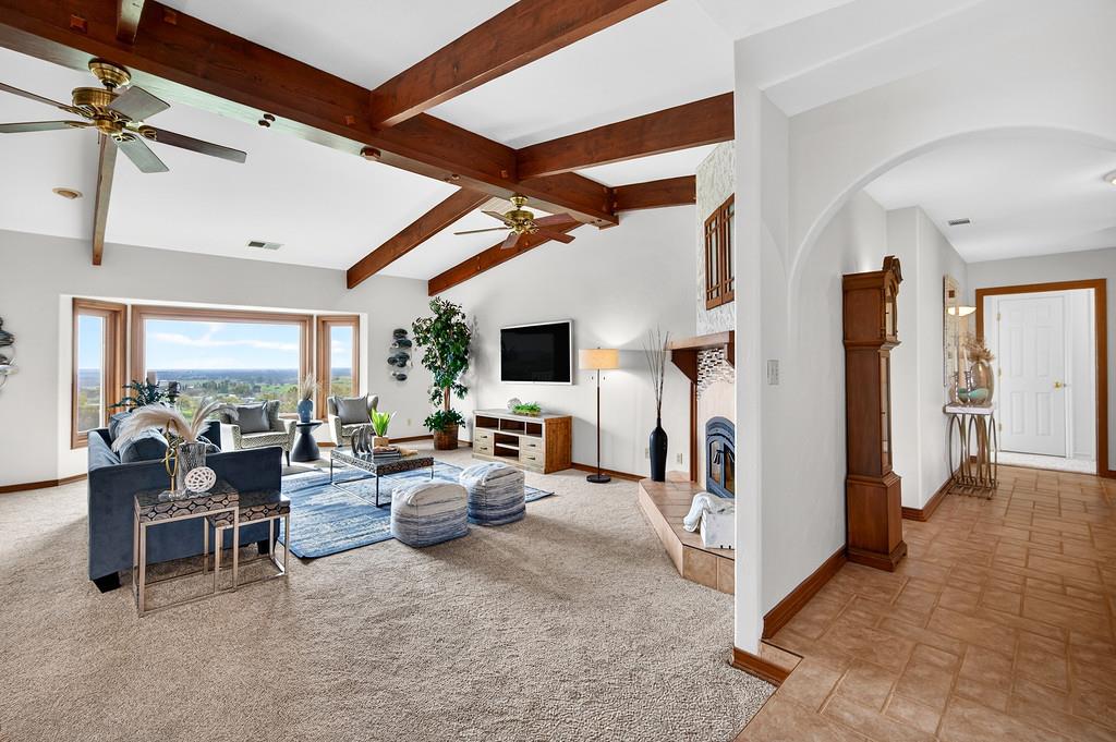 7730 McCourtney Road Lincoln, CA 95648 - Photo 11 of 99 a living room with furniture and a flat screen tv