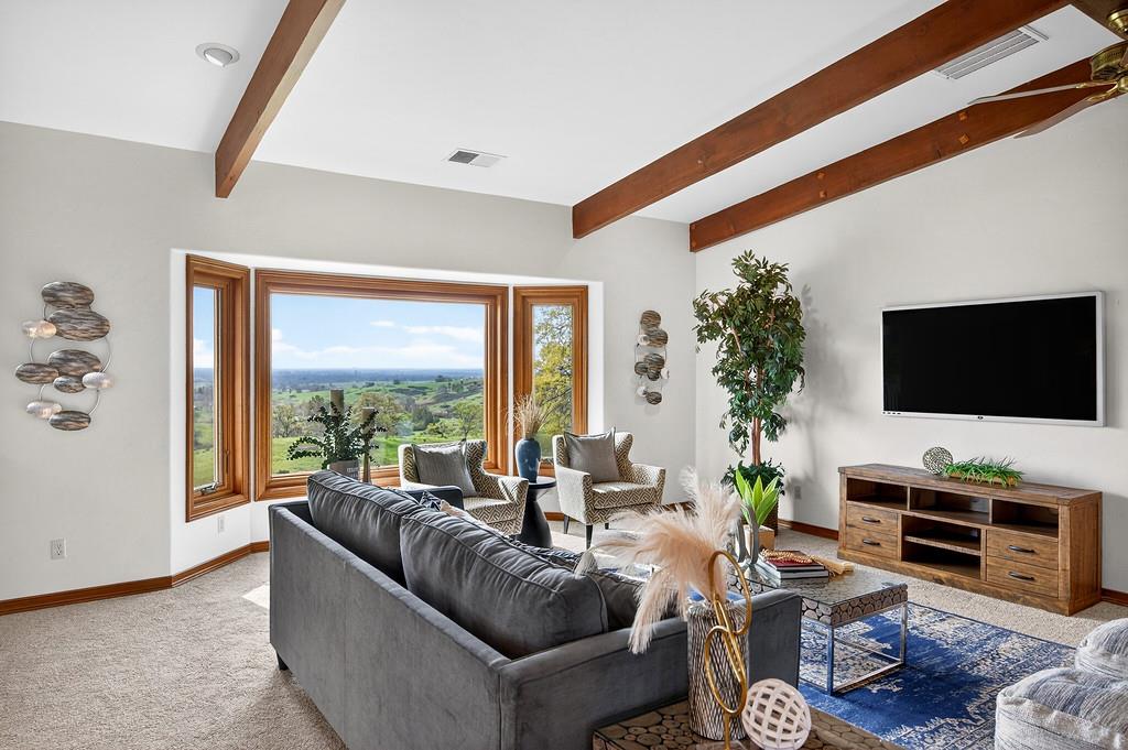 7730 McCourtney Road Lincoln, CA 95648 - Photo 15 of 99 a living room with furniture and a flat screen tv