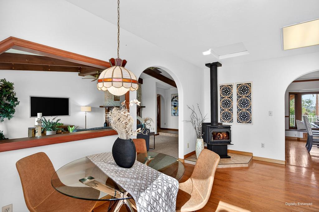 7730 McCourtney Road Lincoln, CA 95648 - Photo 20 of 99 a living room with furniture a flat screen tv and a floor to ceiling window