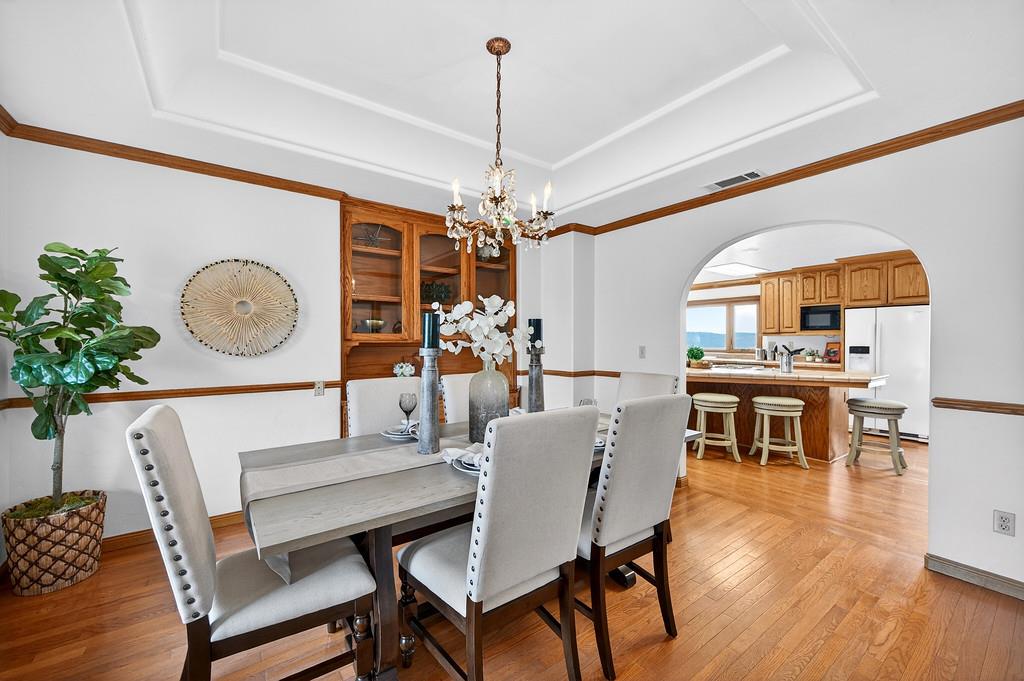 7730 McCourtney Road Lincoln, CA 95648 - Photo 21 of 99 a view of a dining room with furniture window and wooden floor