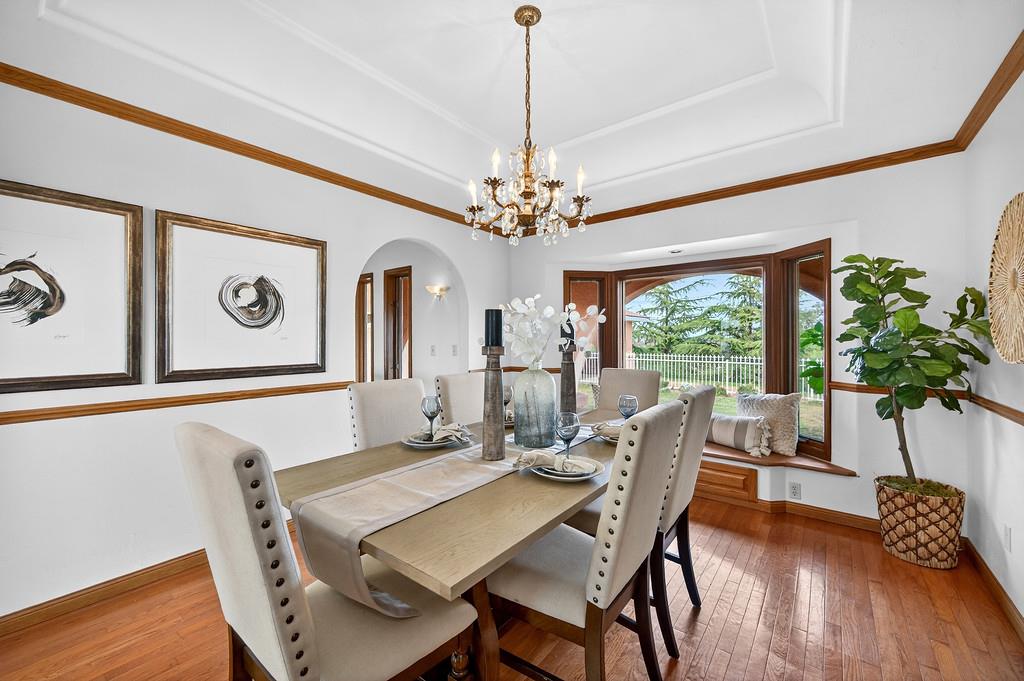 7730 McCourtney Road Lincoln, CA 95648 - Photo 22 of 99 a view of a dining room with furniture window and wooden floor