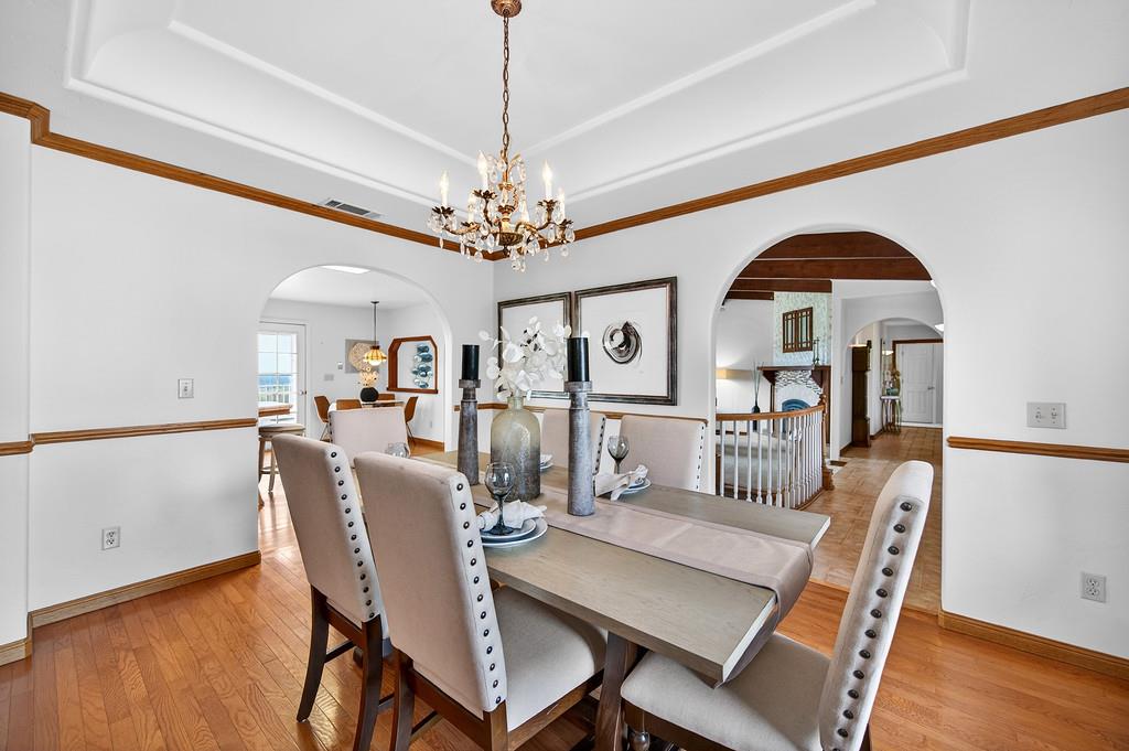 7730 McCourtney Road Lincoln, CA 95648 - Photo 23 of 99 a view of a dining room with furniture and wooden floor