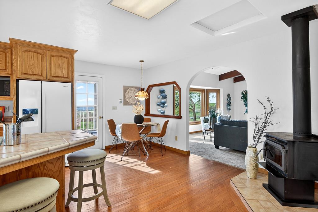 7730 McCourtney Road Lincoln, CA 95648 - Photo 24 of 99 a living room with furniture a rug a fireplace and a large window