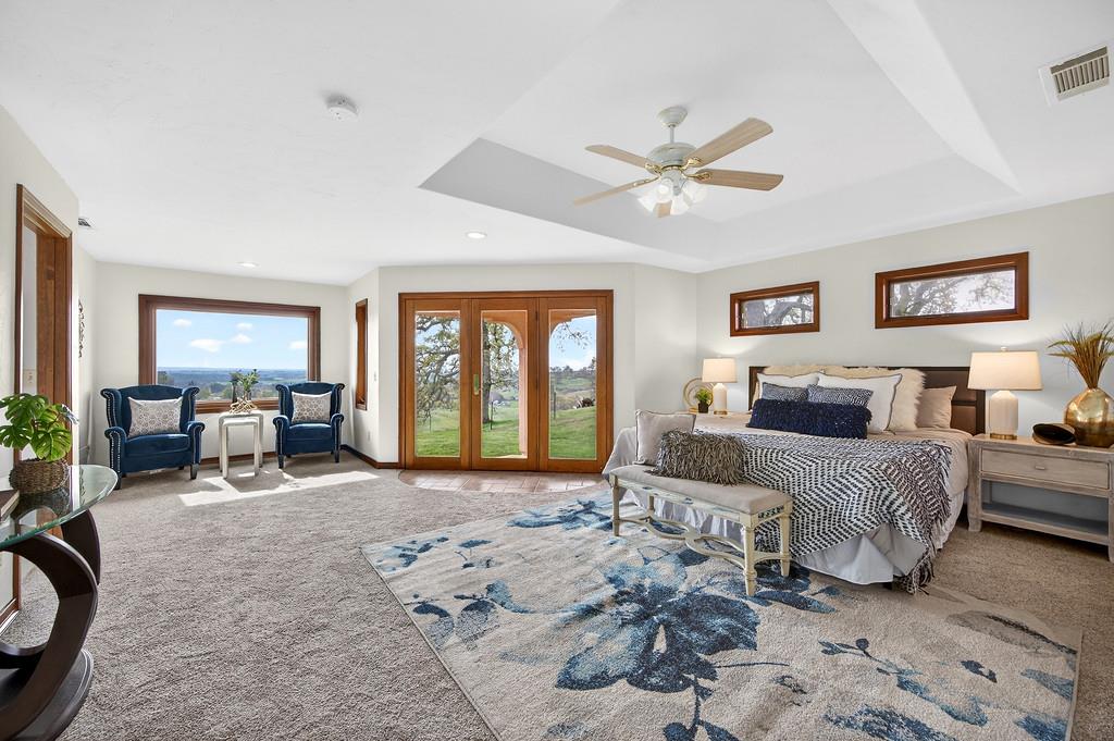 7730 McCourtney Road Lincoln, CA 95648 - Photo 35 of 99 a large bedroom with a large bed couch and a window